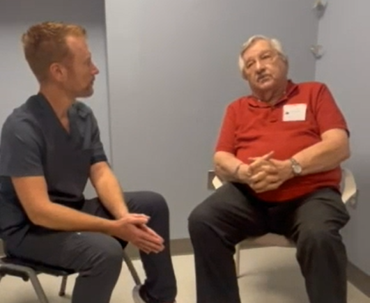 Dr. Bentley speaking with patient