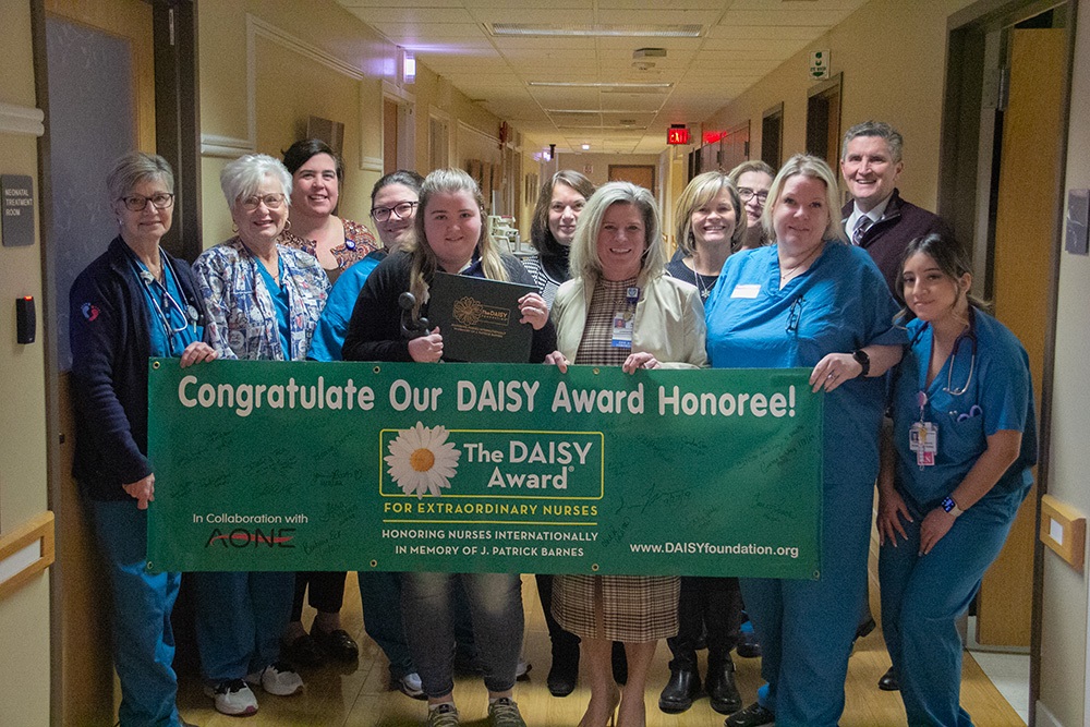 Carissa Frutchey with group for Daisy Award.