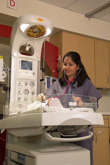 Dr. Chavarkar checking on an infant.