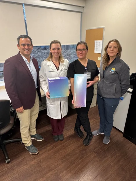 A photo of Dr. Hartigan and representatives from Glean Uro.