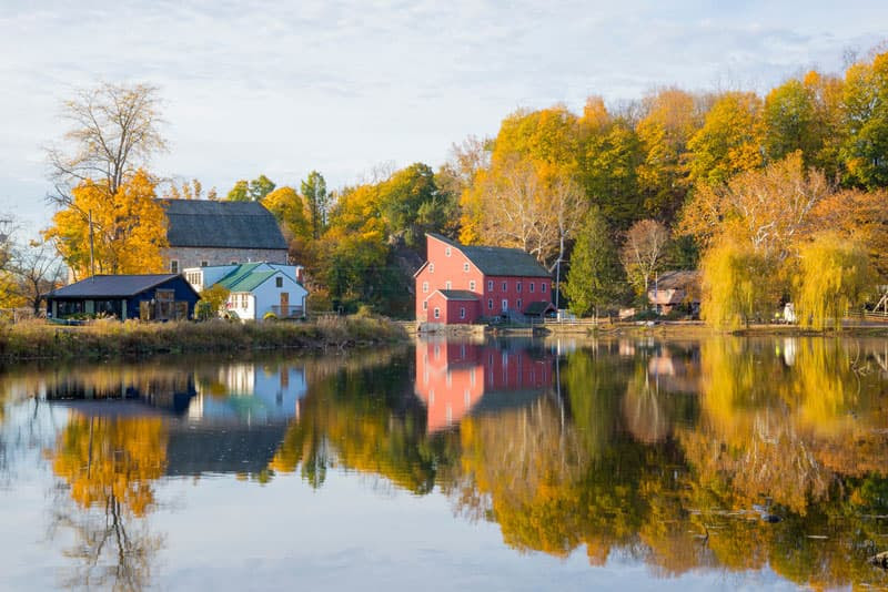 Autumn photo of lake, trees and barn