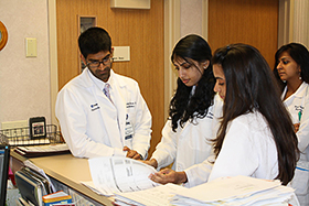 Pharmacy Students working with Preceptor 