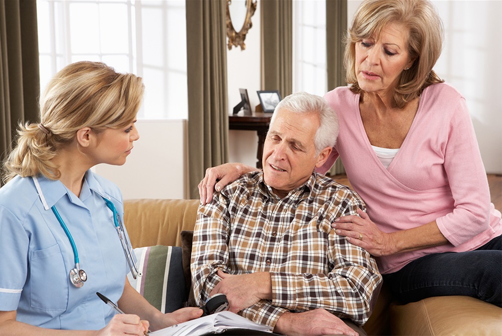 hospice nurse speaking to couple