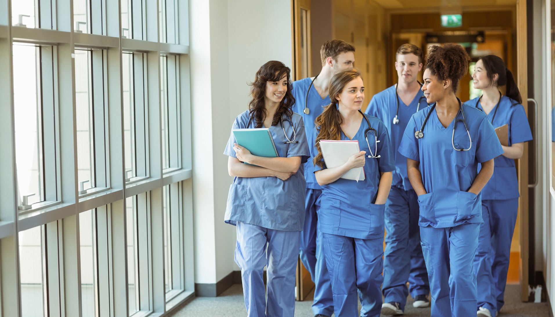 Young med students walking down a hallway