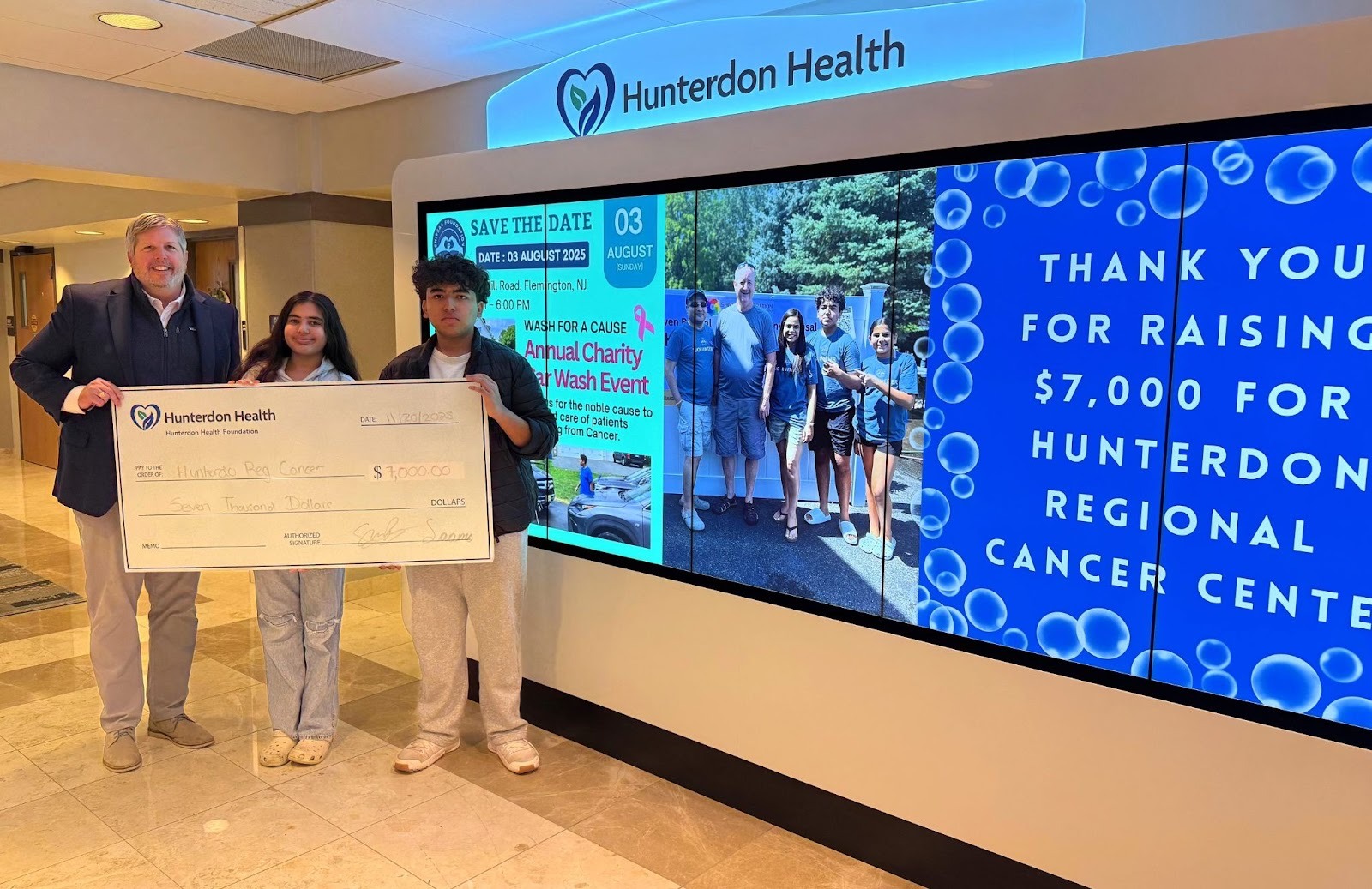 Saanvi and Shiven Bansal present $7,000 check to Hunterdon Health Foundation