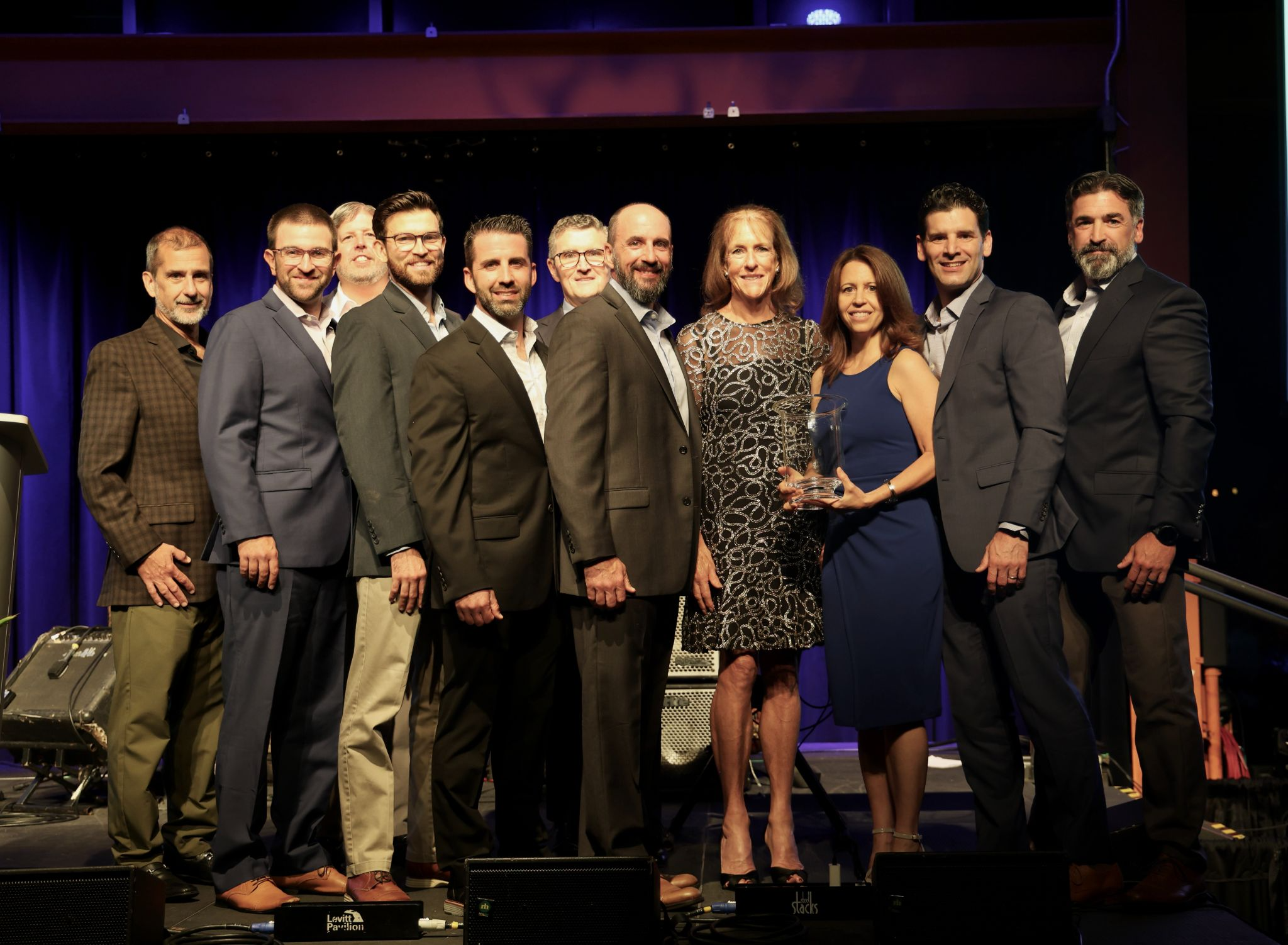 2025 Spirit of Hunterdon Honoree, Pro-Activity accepting their award on stage at the annual Crystal Evening at SteelStacks in Bethlehem, PA