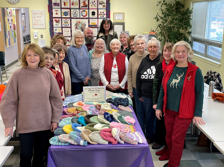Picture of a group with hand knitted caps.