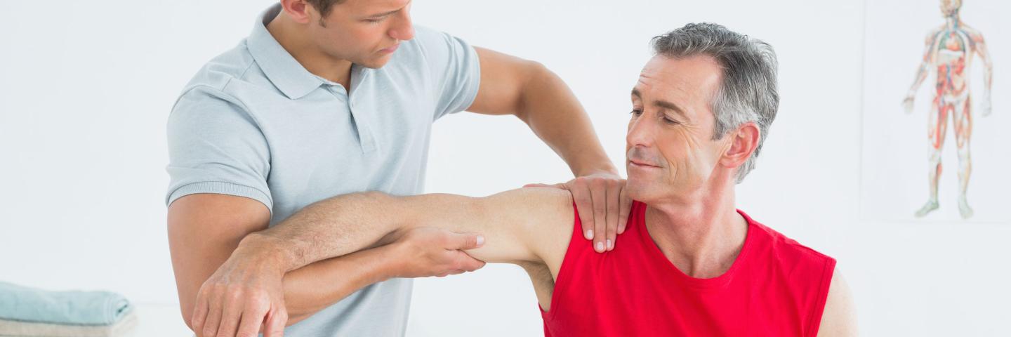 Physical Therapist working on a patient's shoulder