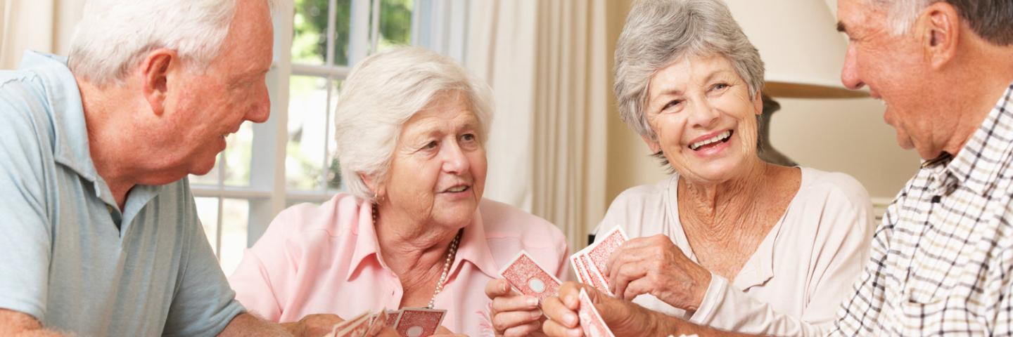Group of seniors enjoying a game of cards