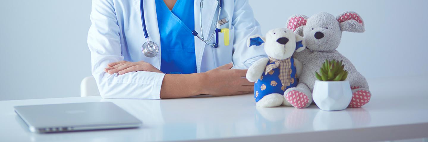 Pediatric doctor at desk