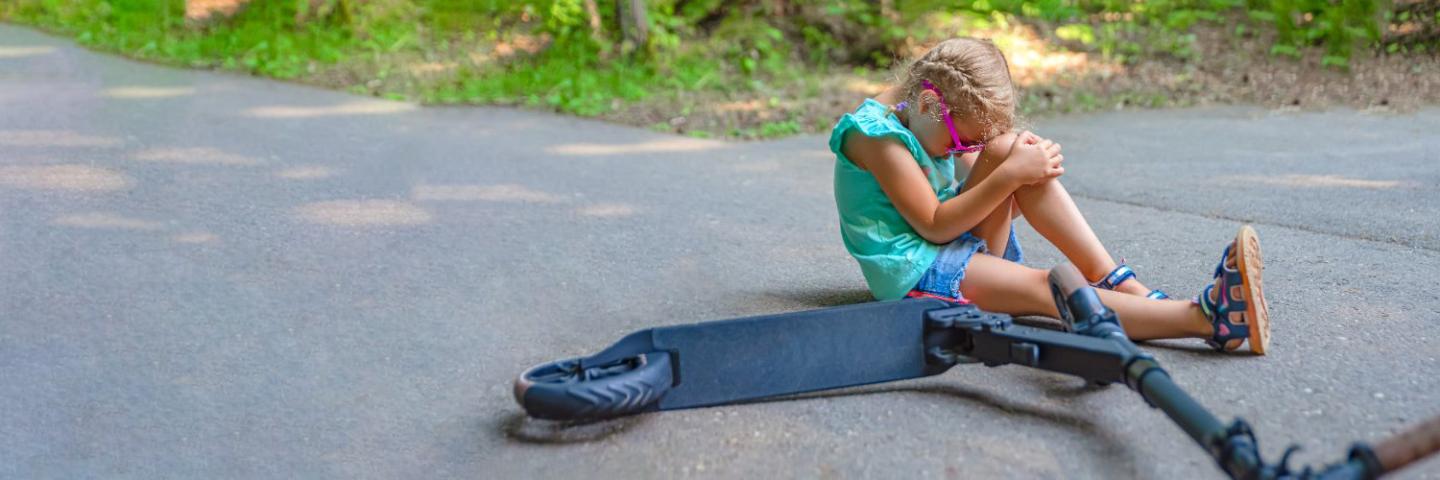 Girl on scooter injured banner