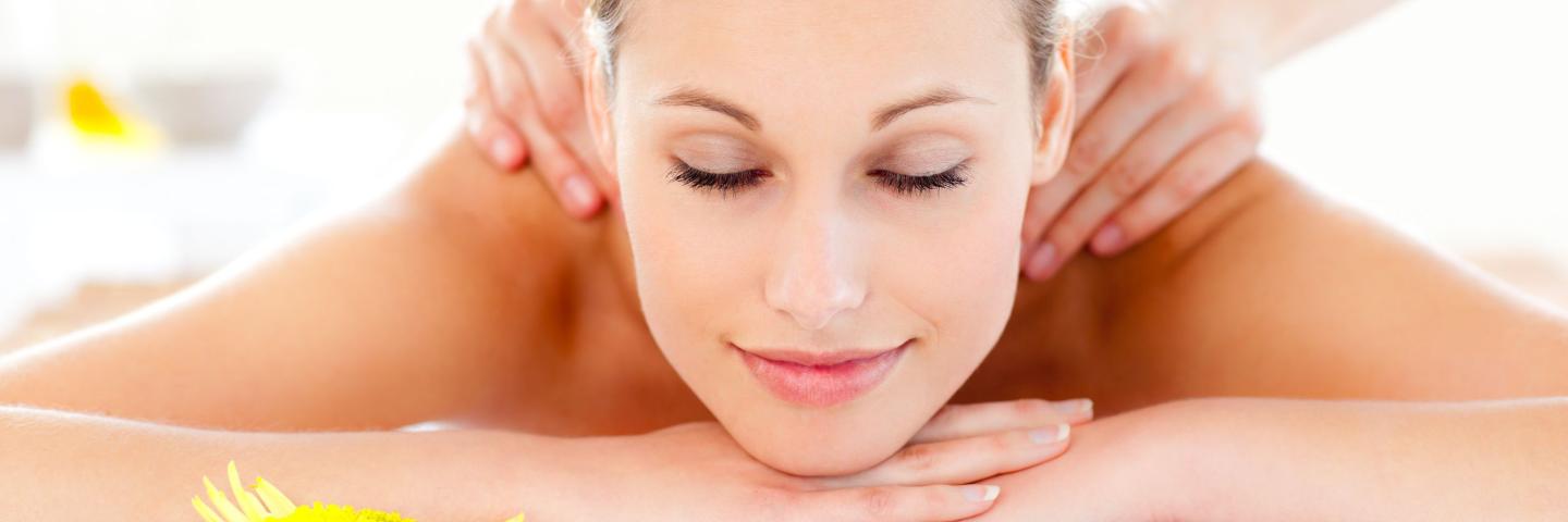 Woman laying on belly receiving a massage