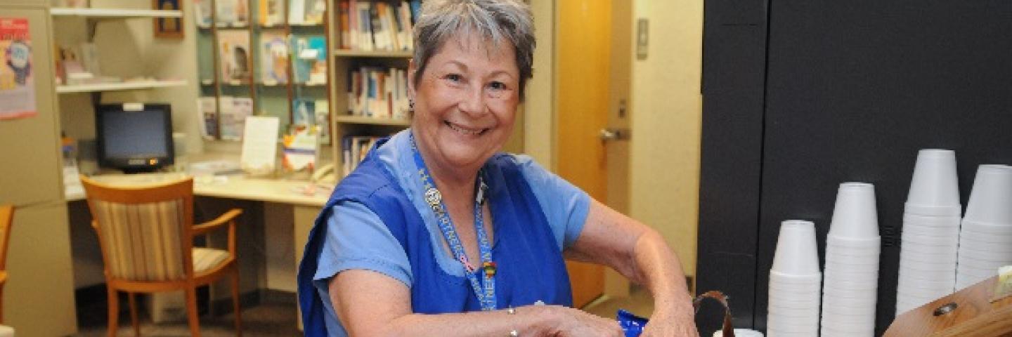 Volunteer with basket of snacks