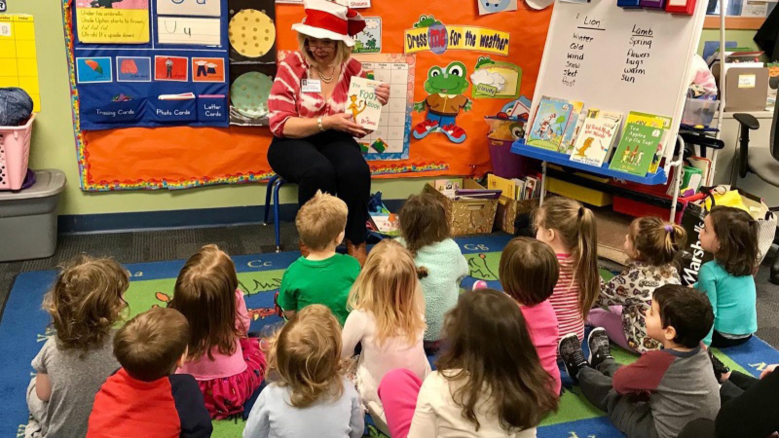 A teacher reads to her class.