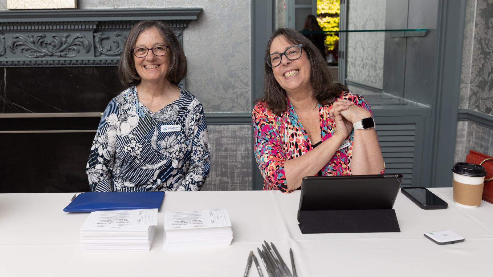 Auxiliary volunteers checking in guests at Splash of Sparkle 2026
