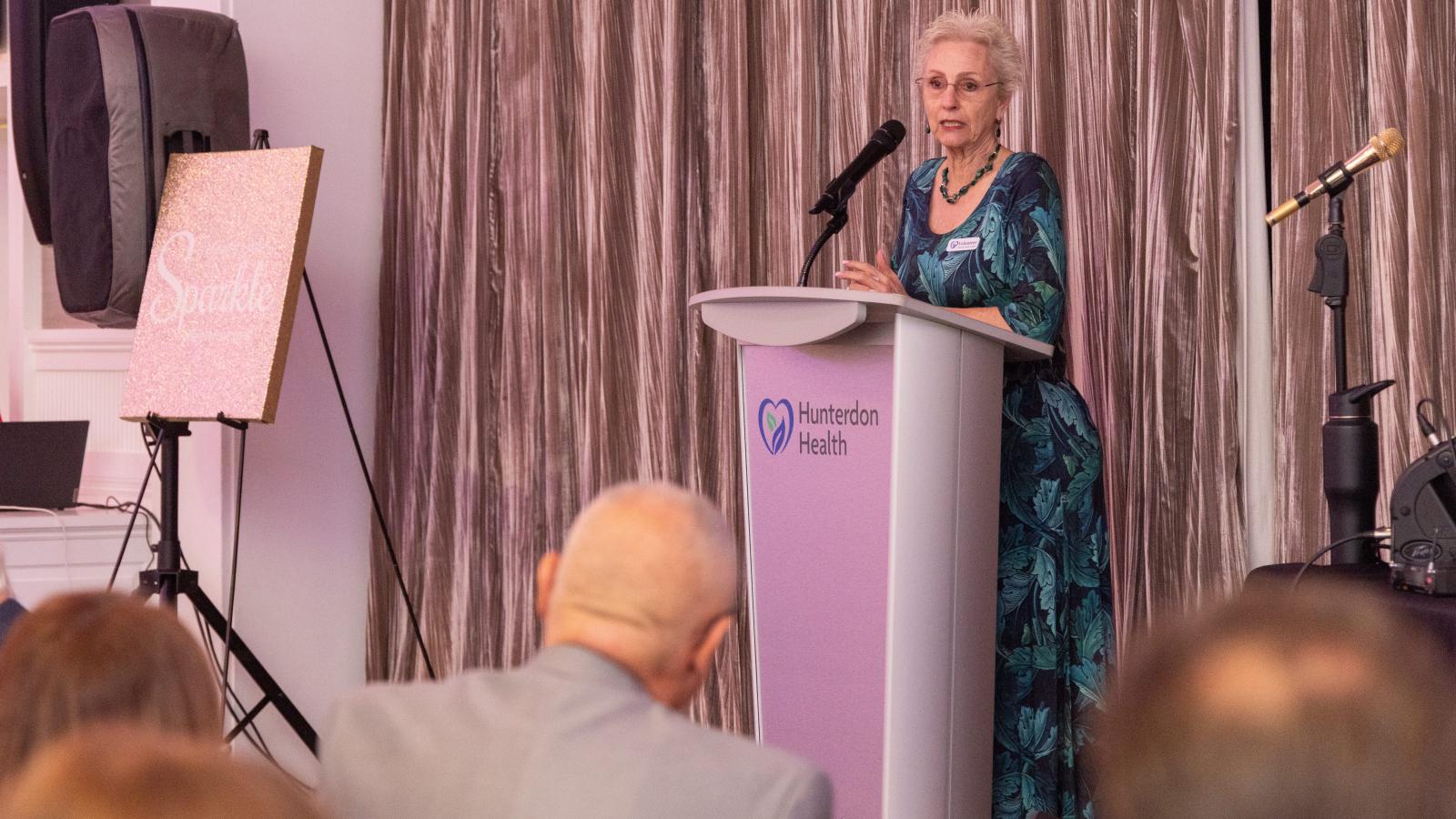 Carol Lunger, Auxiliary President speaking at Splash of Sparkle 2026