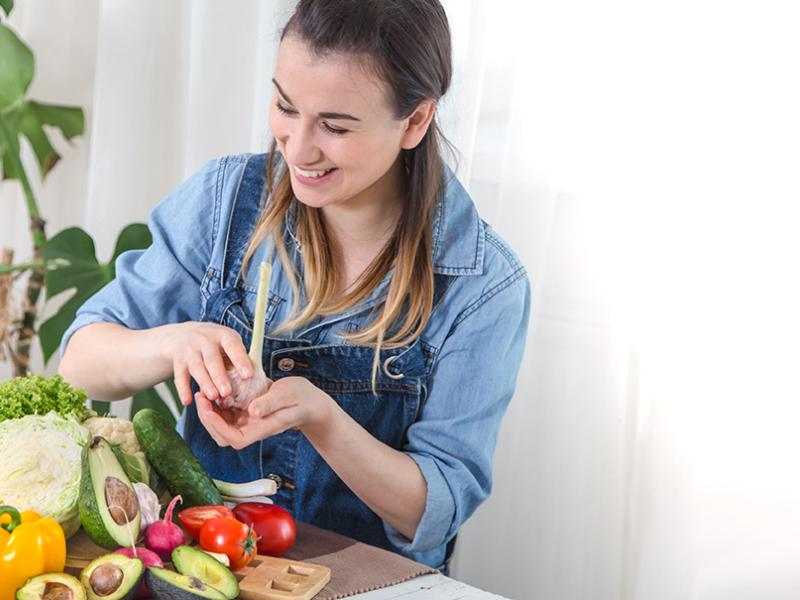 woman cooking vegetables