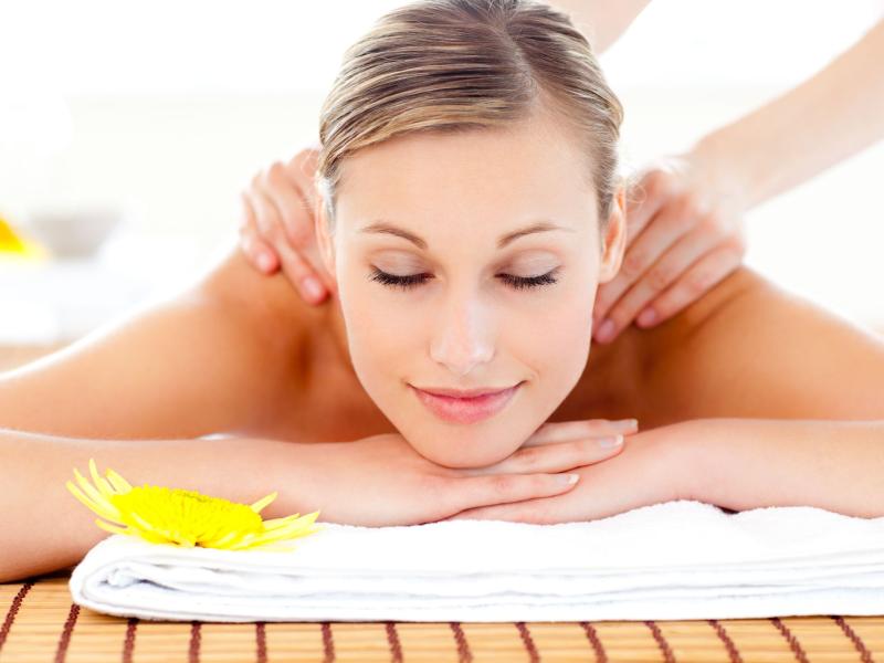 Woman laying on belly receiving a massage