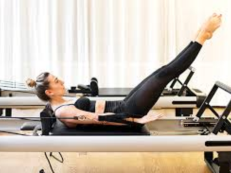 Woman on Pilates machine