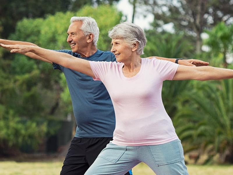 Couple practicing balance outdoors