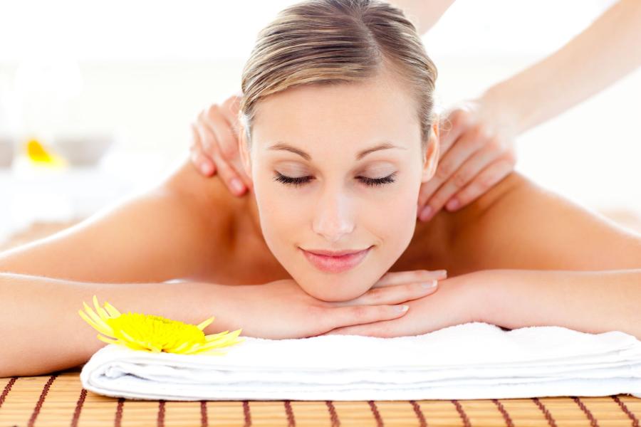 Woman laying on belly receiving a massage