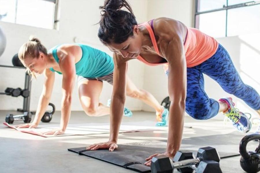 women exercising on gym floor