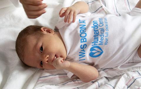 Baby in HMC Onesie