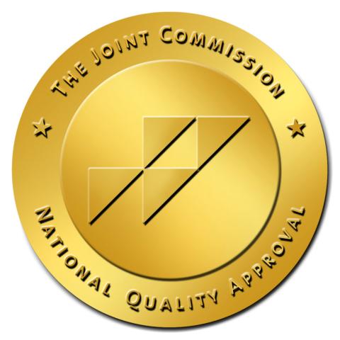 The Joint Commission Logo in gold.