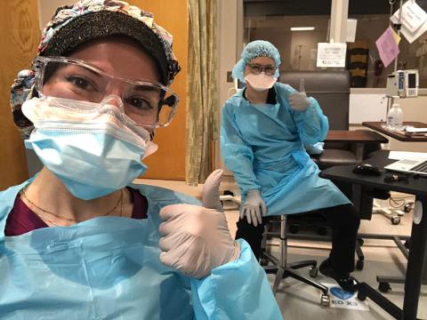 Nurses giving a thumbs up.