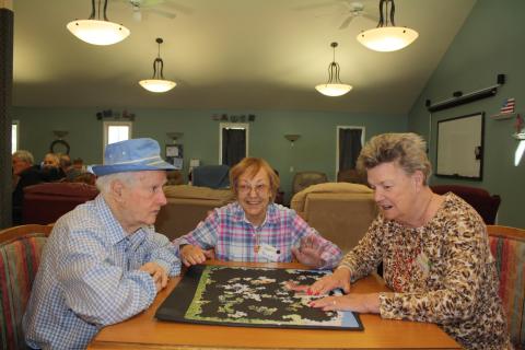 Group sitting playing a game 2016