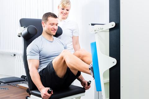 Patient performing leg press during physical therapy