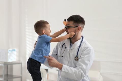 Young boy getting a exam from a Pediatrician 