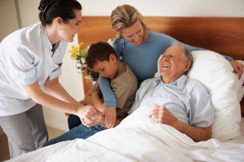Elderly male patient with family and nurse