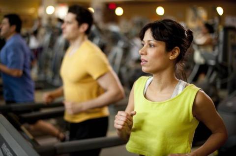 woman running on treadmill