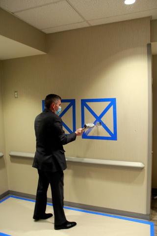 Patrick Gavin, President and CEO,  breaking the wall for Hunterdon Advanced Imaging Center.