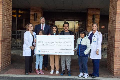 Children gather to donate funds to Hunterdon Regional Cancer Center.