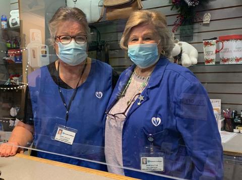 Two female Volunteers in Lobby Shop