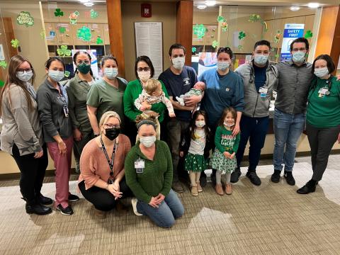 staff gather with family of the first baby delivered by physicians at Hunterdon Family Medicine at Riverfield at Hawk Pointe.  The practice recently added obstetrics to their services.