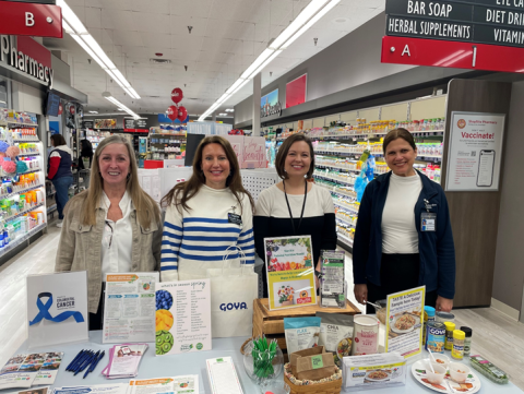 Staff hosting a health and wellness table at ShopRite.