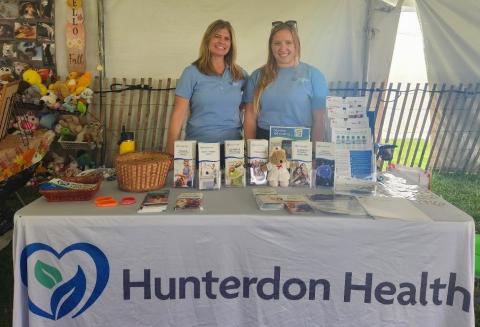 Hunterdon staff behind a table at Somerset 4H Fair