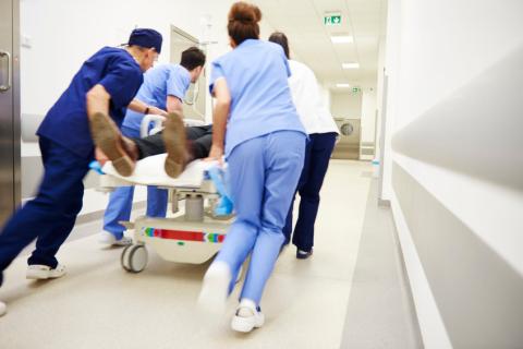 ED Staff rushing patient into Emergency Department